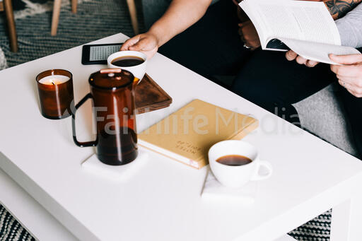 Couple Reading and Drinking Coffee