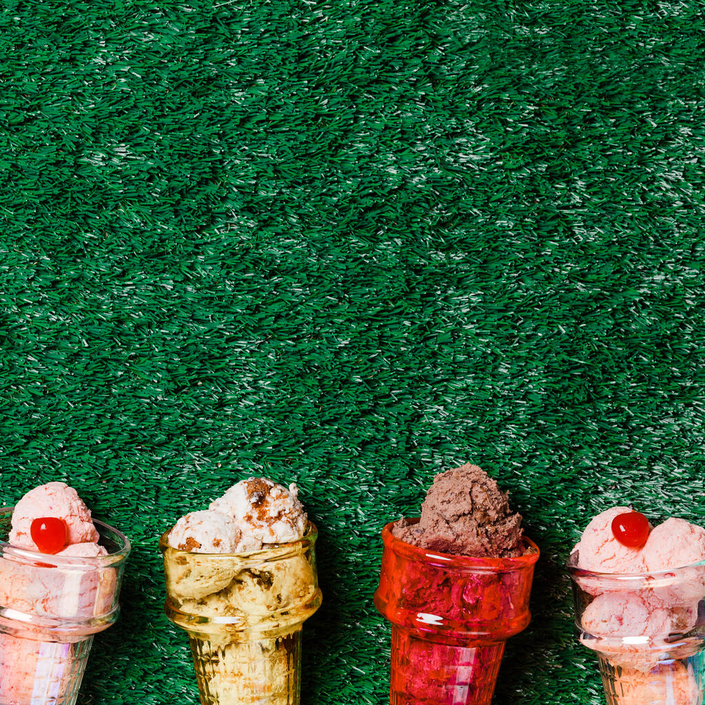 Ice Cream in Colorful Cone Dishes on Grass large preview