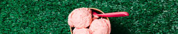 Carton of Strawberry Ice Cream with a Spoon on Grass  image 2