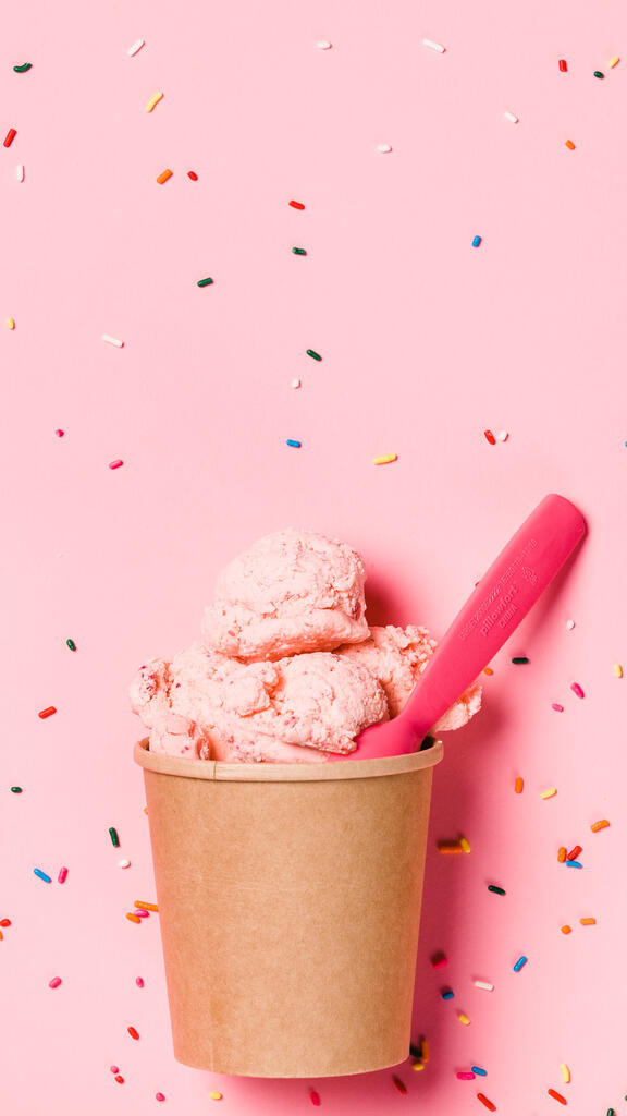 Cartons of Ice Cream with Spoons on Pink Background large preview