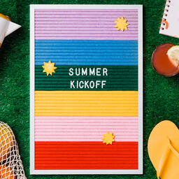 Summer Kickoff Letter Board with Summer Supplies on Grass  image 1
