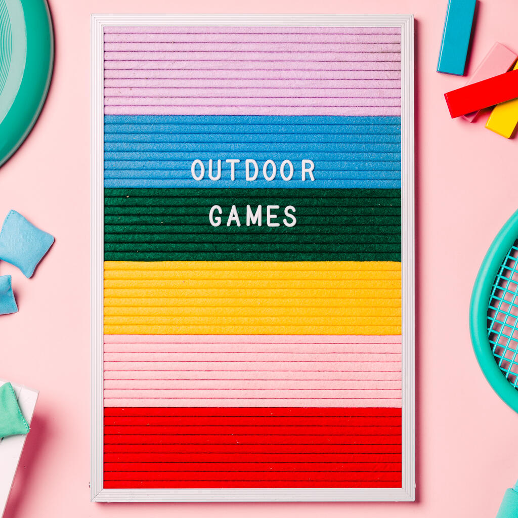 Outdoor Games Letter Board with Game Supplies on Pink Background large preview