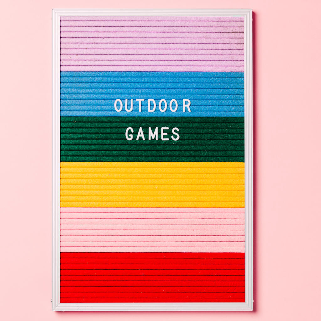 Outdoor Games Letter Board with Game Supplies on Pink Background large preview