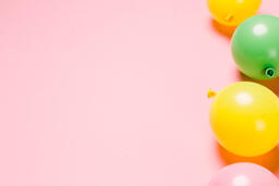 Citrus Colored Balloons Scattered on Pink Background  image 2