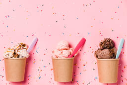 Cartons of Ice Cream with Spoons on Pink Background  image 2