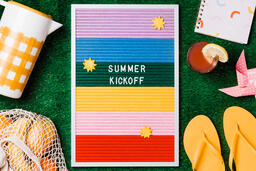 Summer Kickoff Letter Board with Summer Supplies on Grass  image 5