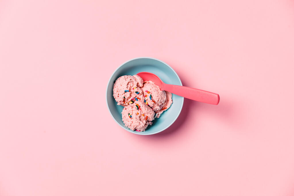 A Blue Bowl of Strawberry Ice Cream on Pink Background large preview