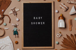 Welcome Baby Letter Board Surrounded by Baby Items  image 1