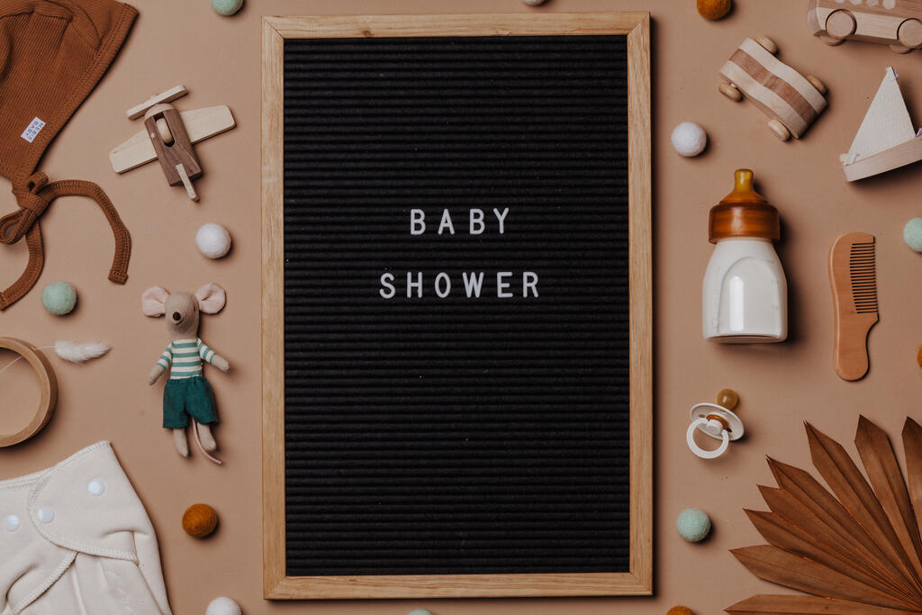 Welcome Baby Letter Board Surrounded by Baby Items large preview