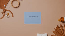 Pink Baby Shower Invitation Surrounded by Baby Items  image 1