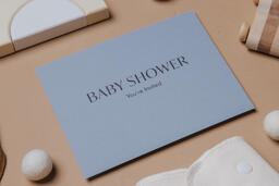Blue Baby Shower Invitation Surrounded by Baby Items  image 9