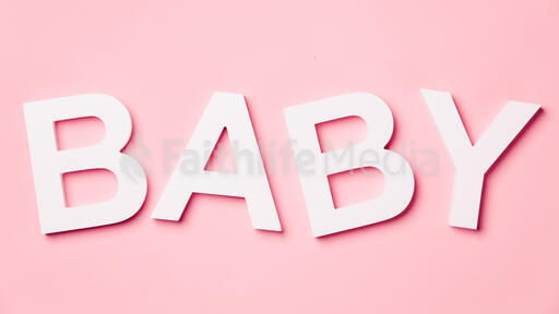 BABY on Pink Background with Felt Polka-Dots