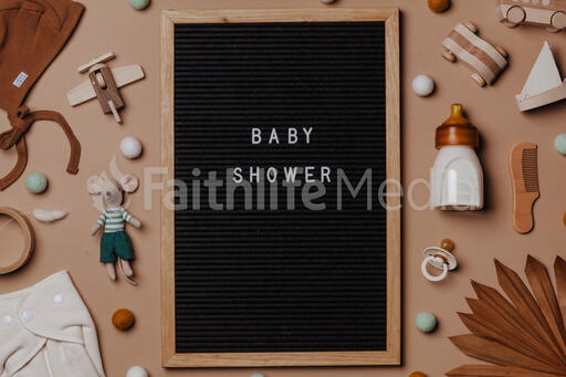 Welcome Baby Letter Board Surrounded by Baby Items