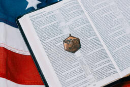 Open Bible with a Military Medallion on an American Flag  image 4