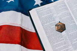 Open Bible with a Military Medallion on an American Flag  image 2