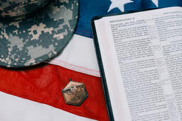 Military Hat and Open Bible on an American Flag  image 3