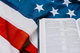 Open Bible on an American Flag  image 1