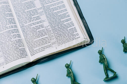 Open Bible with Toy Soldiers