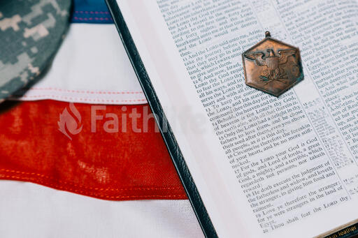 Open Bible with a Military Medallion on an American Flag