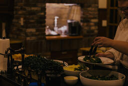 Woman Serving Up Salad  image 2