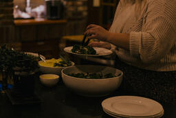 Woman Serving Up Salad  image 1