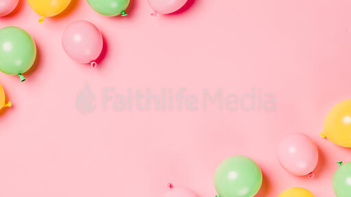 Citrus Colored Balloons Scattered on Pink Background