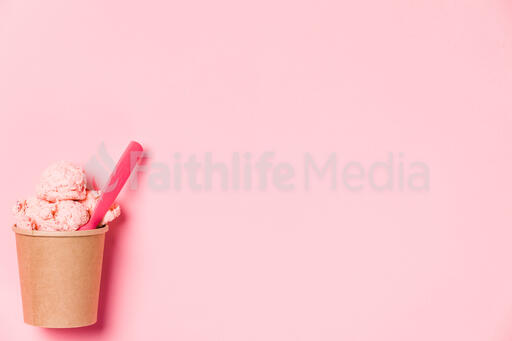 Carton of Strawberry Ice Cream with a Pink Spoon