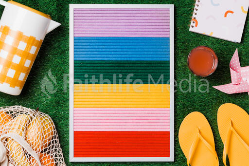 Letter Board with Summer Supplies on Grass