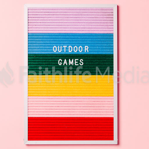 Outdoor Games Letter Board with Game Supplies on Pink Background