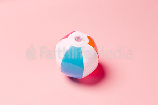 Beach Ball on Pink Background