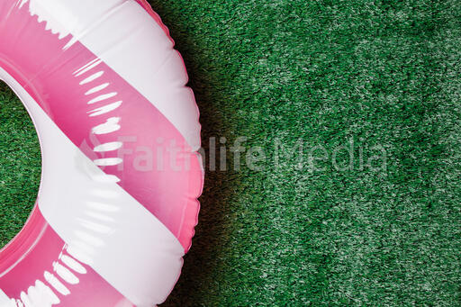 Blue and White Inner Tube on Grass