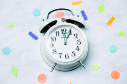 Clock Striking Midnight with Confetti  image 1