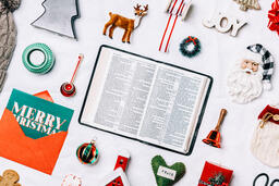 Open Bible with Commercial Christmas Items  image 1