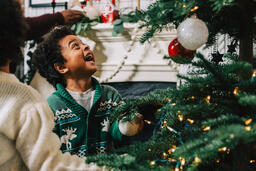 Kids Decorating the Christmas Tree Together  image 5
