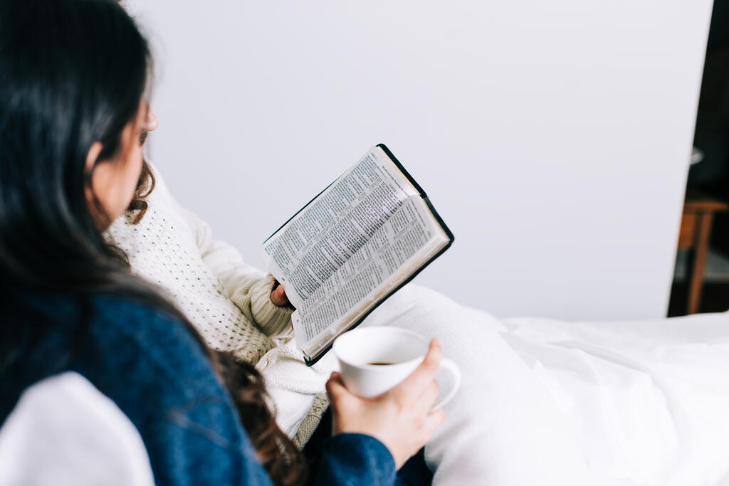 Husband and Wife Reading the Bible Together in Bed large preview