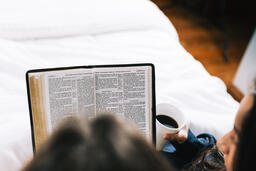 Husband and Wife Reading the Bible Together in Bed  image 2