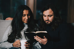 Husband and Wife Reading the Bible Together  image 1
