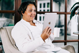 Woman Reading on a Tablet  image 3