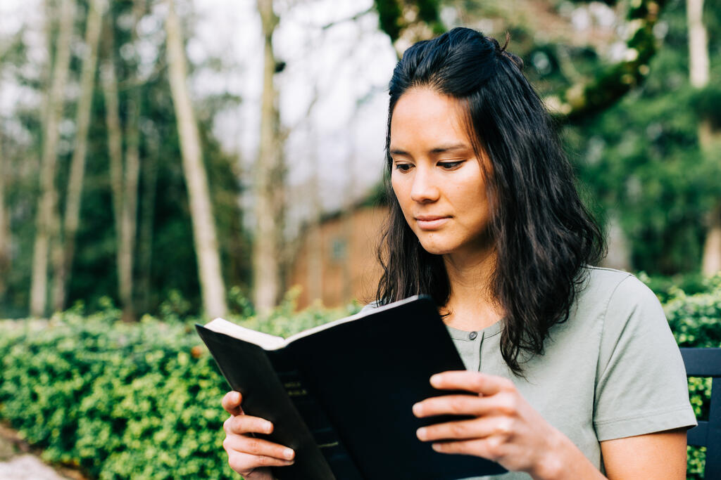 Woman Reading the Bible on the Patio Outside large preview