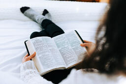 Woman Reading the Bible in Bed  image 1