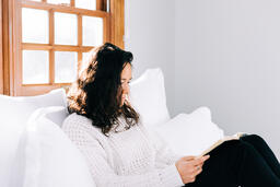 Woman Reading the Bible in Bed at Sunrise  image 3