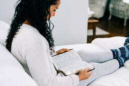 Woman Reading the Bible in Bed  image 1