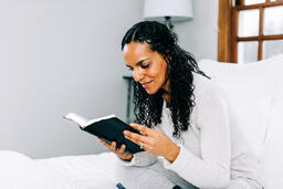 Woman Reading the Bible in Bed  image 3