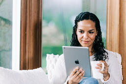 Woman Reading on a Tablet  image 1