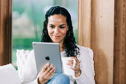 Woman Reading on a Tablet  image 3