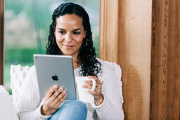 Woman Reading on a Tablet  image 2