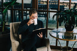 Man Reading the Bible with a Cup of Coffee  image 2