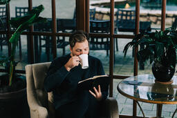 Man Reading the Bible with a Cup of Coffee  image 5