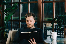 Man Reading the Bible with a Cup of Coffee  image 2