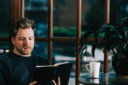 Man Reading the Bible with a Cup of Coffee  image 3